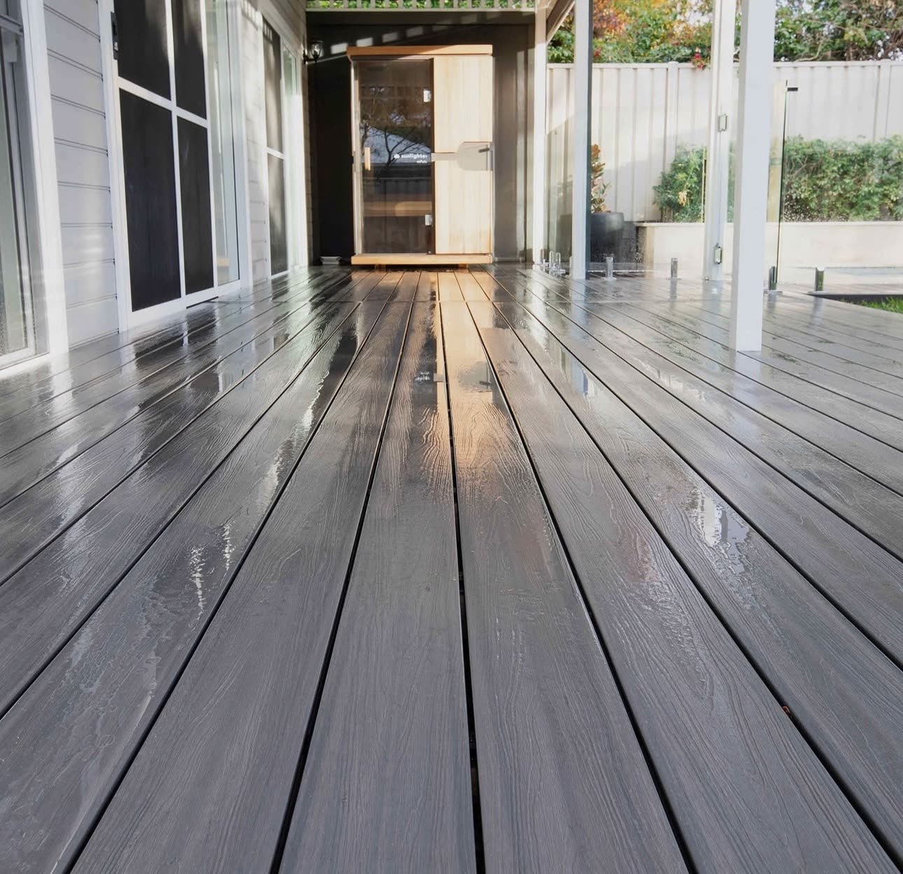 Charcoal composite decking along a covered alfresco area