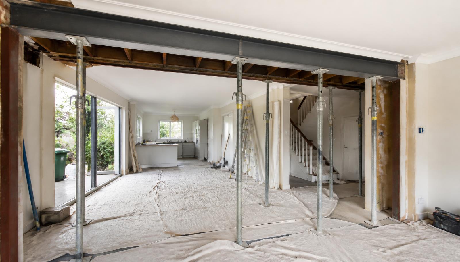 Exposed structural steel beam replacing a load bearing wall during an open-plan renovation