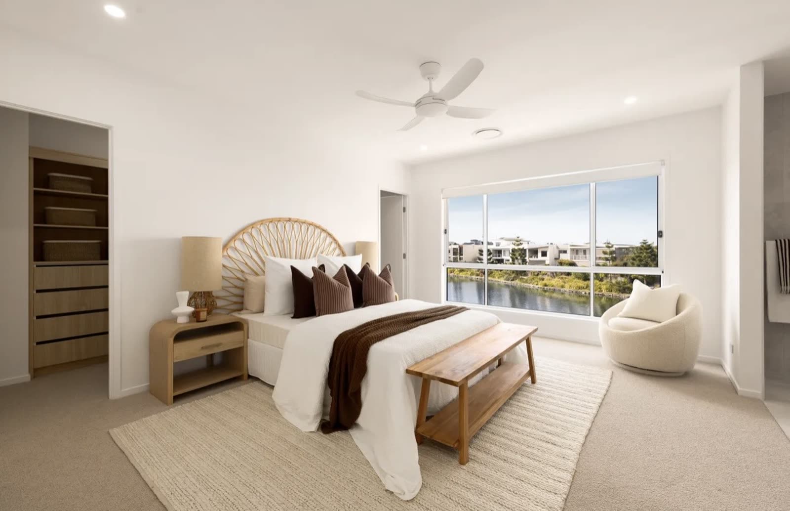 Master bedroom renovation with walk-in robe and waterfront outlook