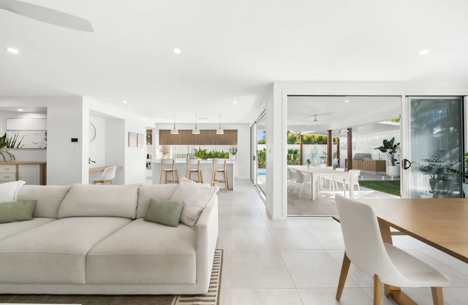 Open plan living and dining renovation opening onto a covered outdoor entertaining area