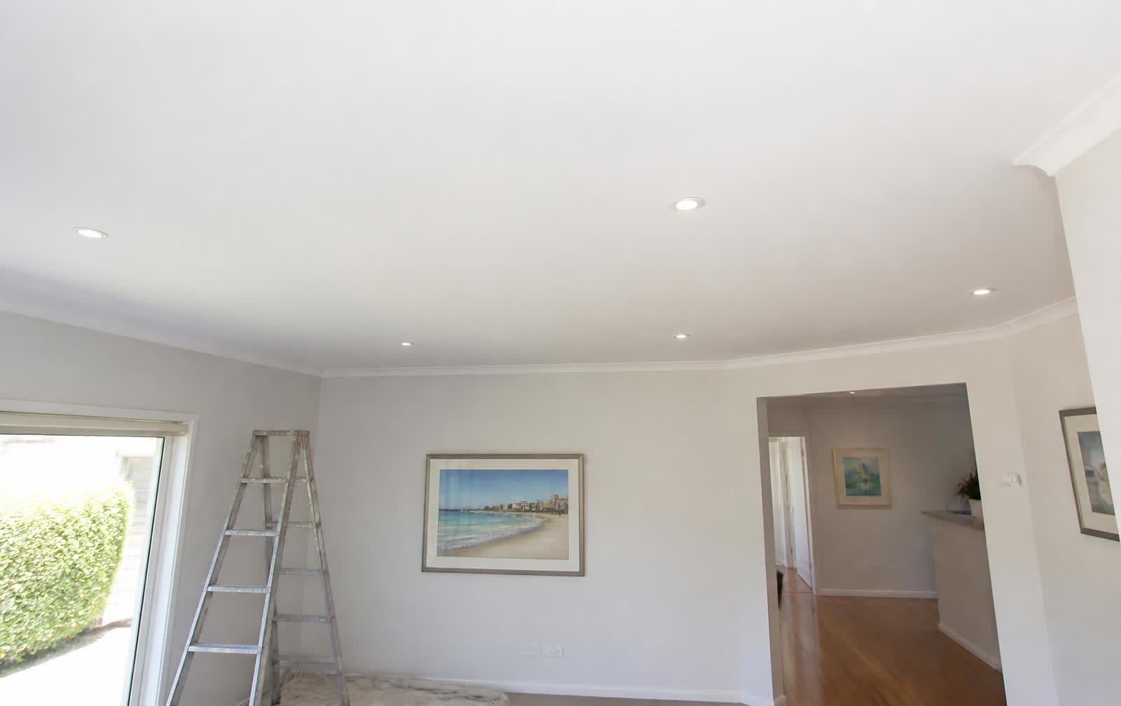 Repaired and repainted plasterboard ceiling in a residential living room