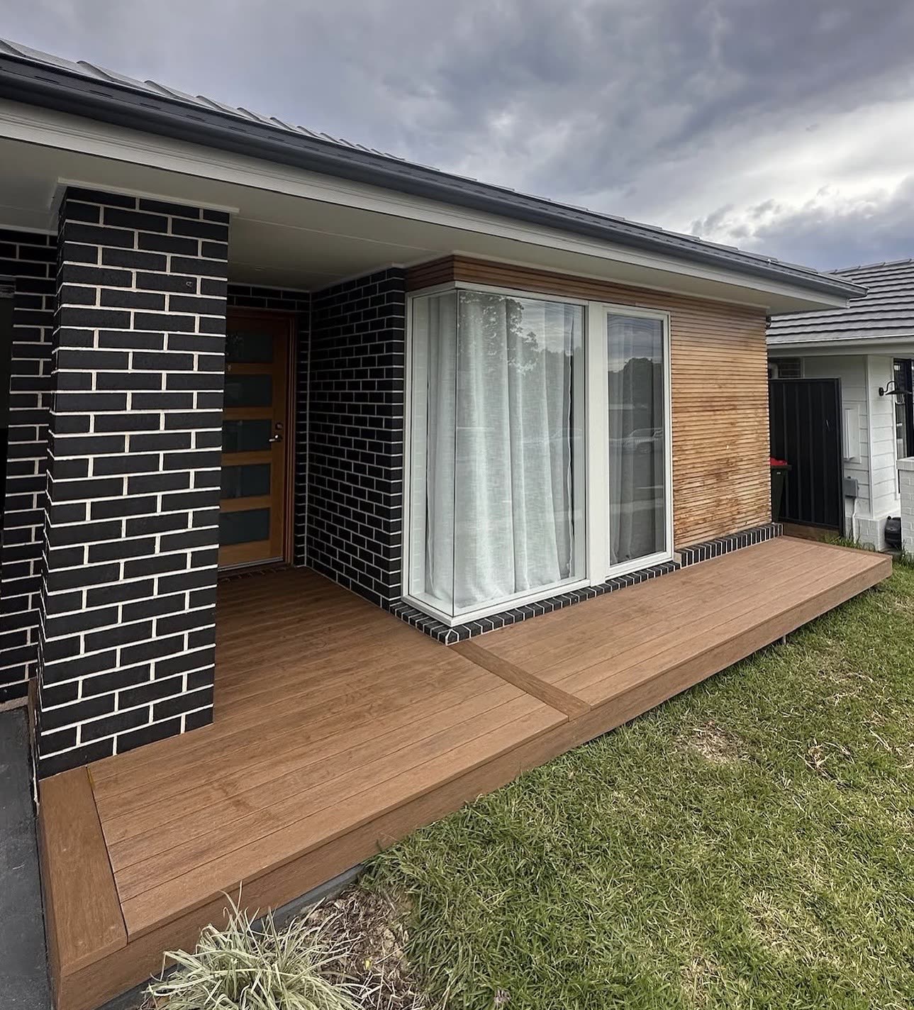Composite front porch deck on a brick home