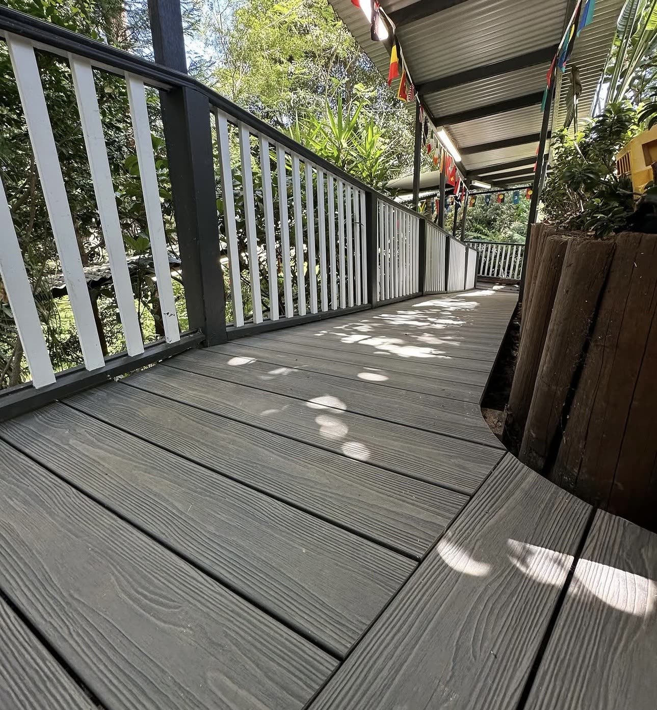 Grey composite walkway deck with white balustrade