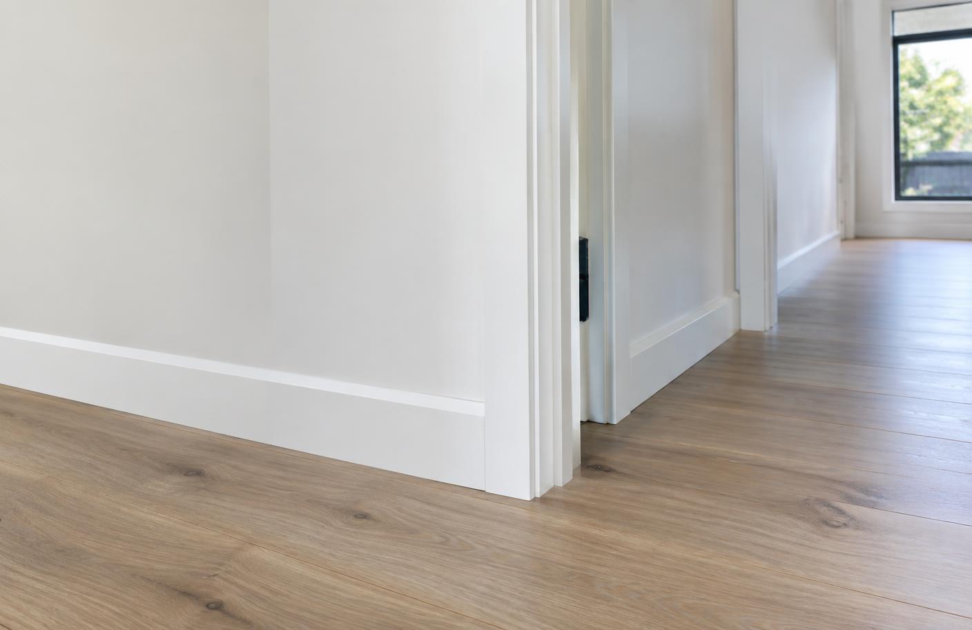 Freshly installed skirting boards and door architraves